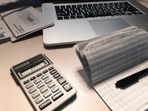 Laptop with bills twenty20_6dcf25db-3681-49a6-ad01-8d2af6a1f183 Laptop with bills twenty20_6dcf25db-3681-49a6-ad01-8d2af6a1f183
