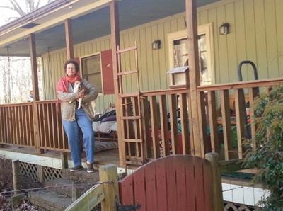 Martha Worley Photo of Martha Worley, a homeowner and Self-Help member, in front of her home in Asheville