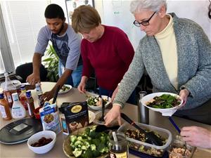 Self-Help staffers at pot luck salad bar